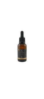 Bottle of serum with dropper on a light gray background