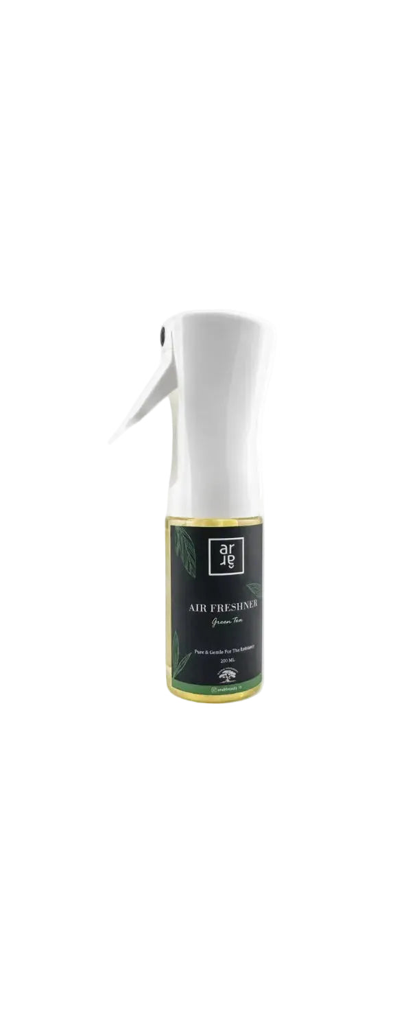 Air freshener spray bottle with a white nozzle on a light gray background