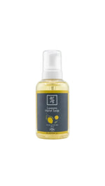 Bottle of lemon hand soap with a gray label on a white background