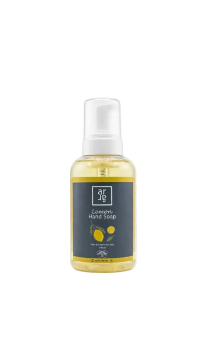 Bottle of lemon hand soap with a gray label on a white background