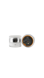 Night cream jar with silver lid on a white background