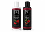Two bottles of Arde Pomegranate Shampoo and Conditioner on a white background